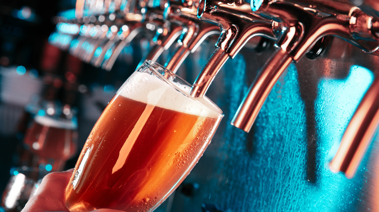 draft beer being poured from a tap