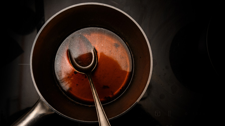 pot filled with dark colored stock