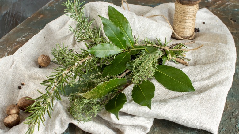 Bouquet garni and twine on cheesecloth