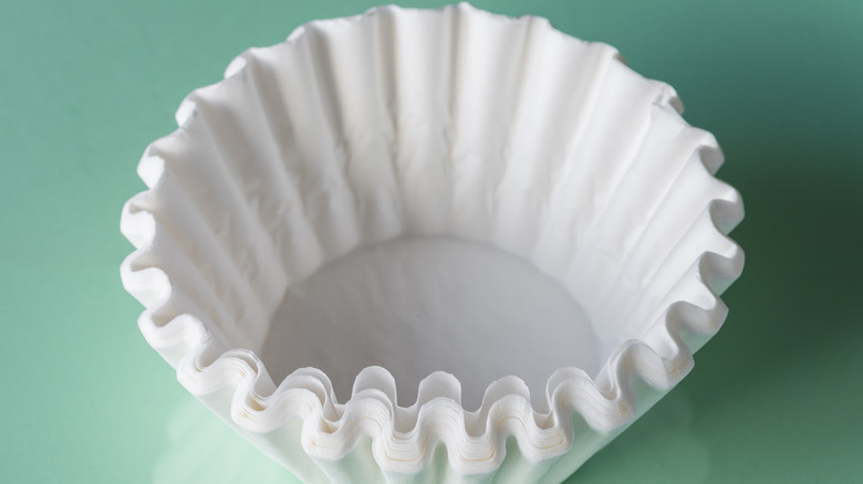 coffee filters on green background