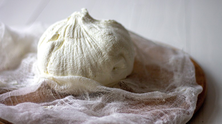 cheese wrapped in cheesecloth