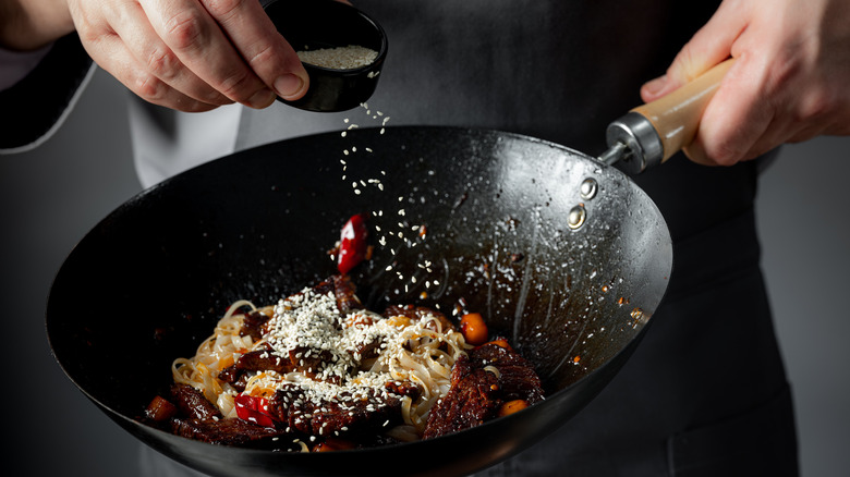 stir-frying food in wok