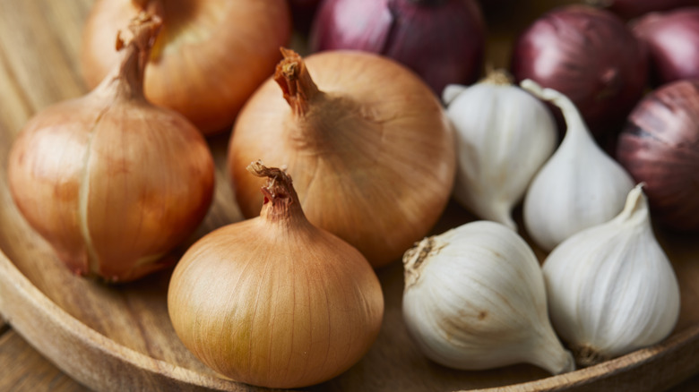 whole garlic bulbs and onions