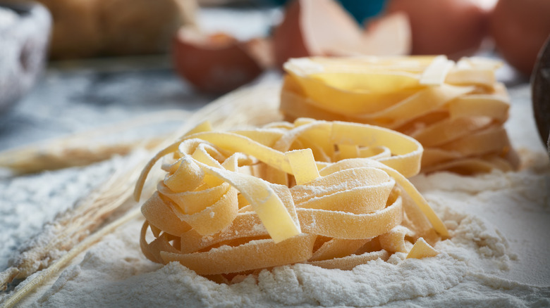 homemade fettuccine noodles in flour