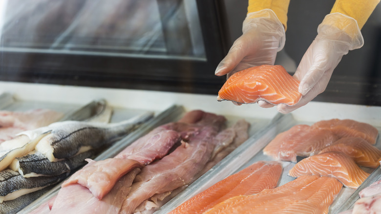 Selecting seafood at market