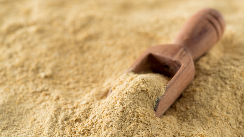 Nutritional yeast and wooden spoon