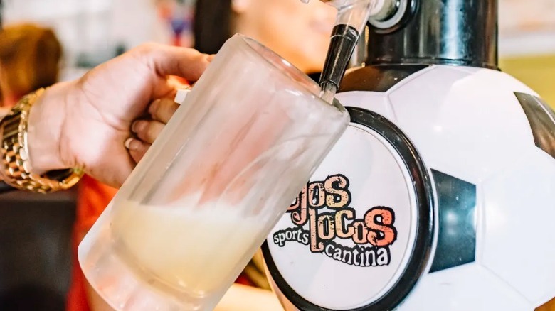 Ojos Locos waitress filling a mug