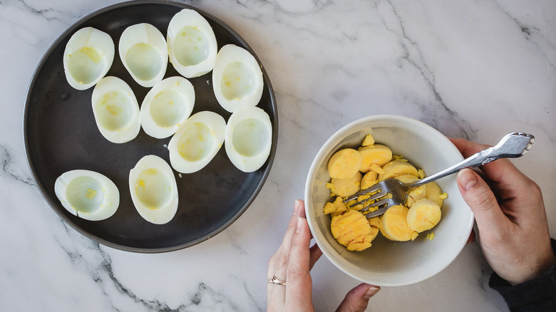 egg halves and bowl of yolks