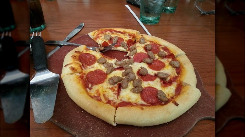 olive garden pizza topped with pepperoni and sausage