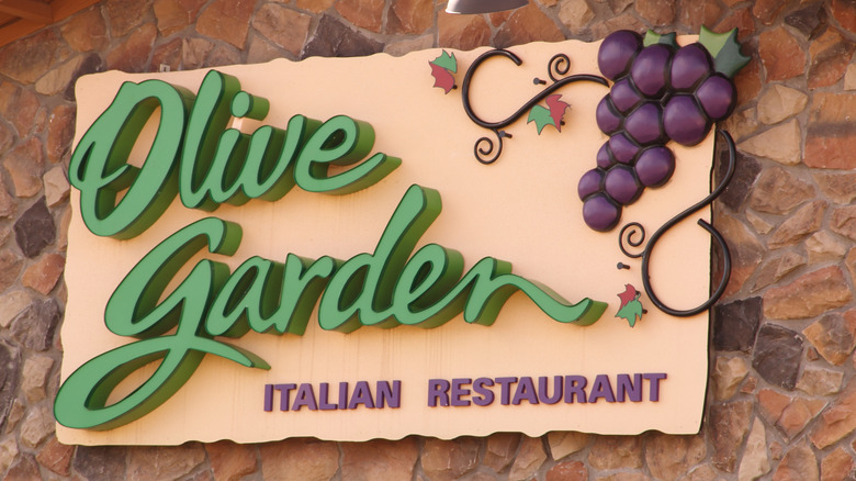 Olive Garden sign on stone background