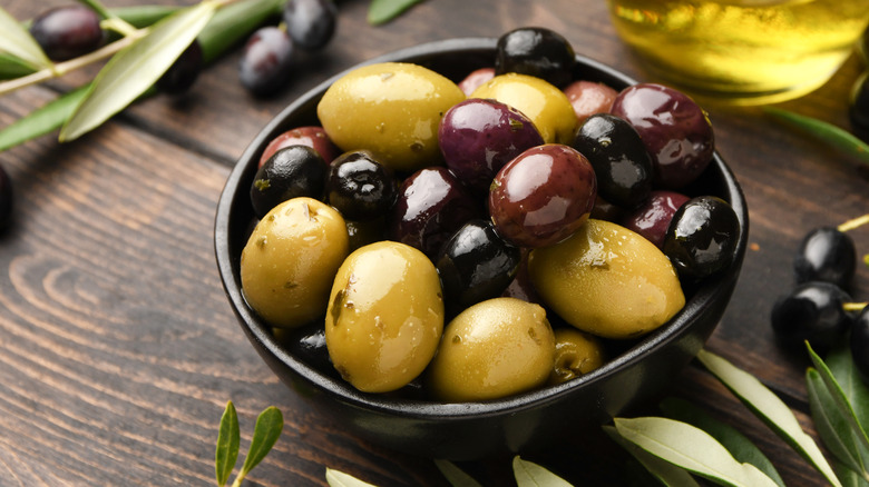 Assortment of olives in black bowl