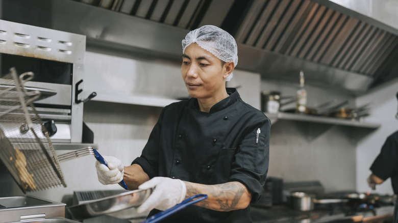 restaurant worker in hair net