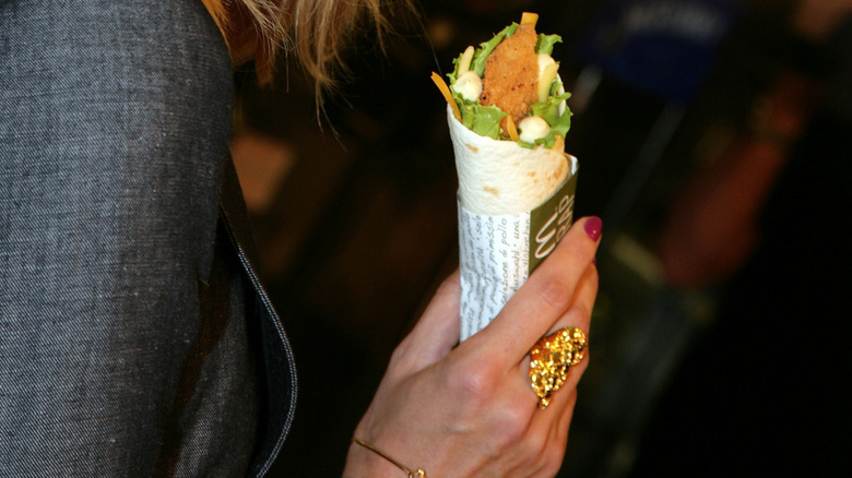 hand holding snack wrap