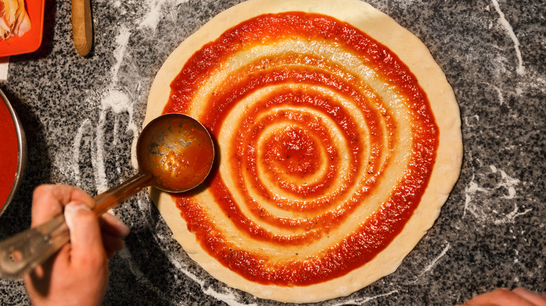 Pizza dough with a sauce swirl