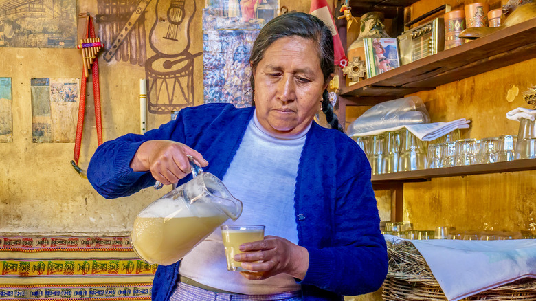 woman pouring chicha