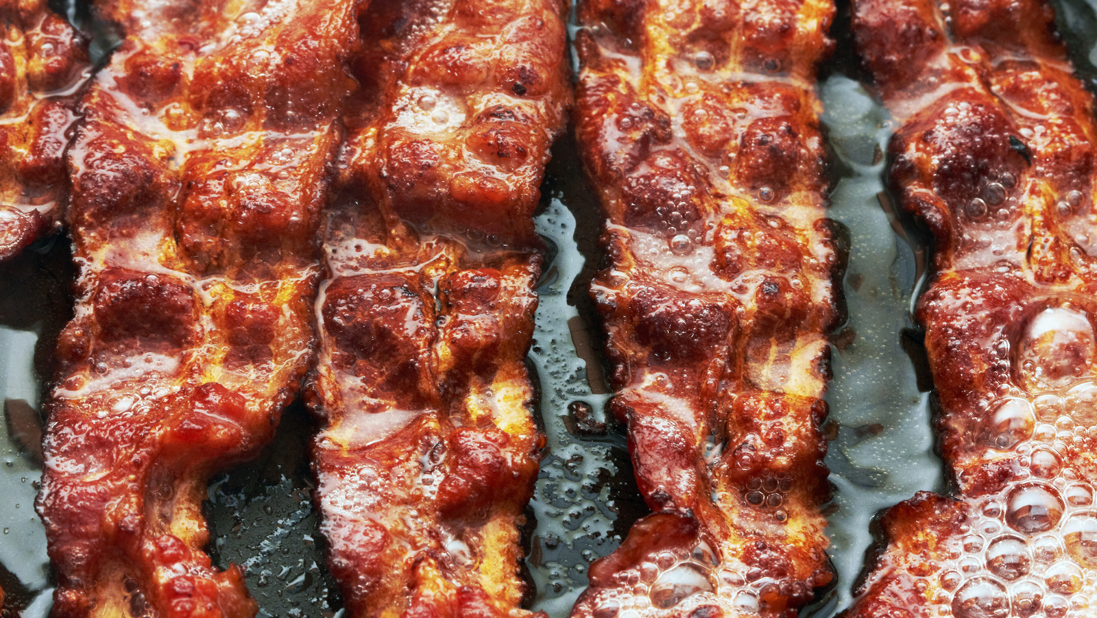 https://www.thedailymeal.com/img/gallery/one-unexpected-ingredient-will-always-give-you-crispy-bacon/l-intro-1668546290.jpg