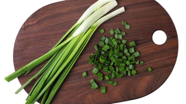 Green onions on cutting board