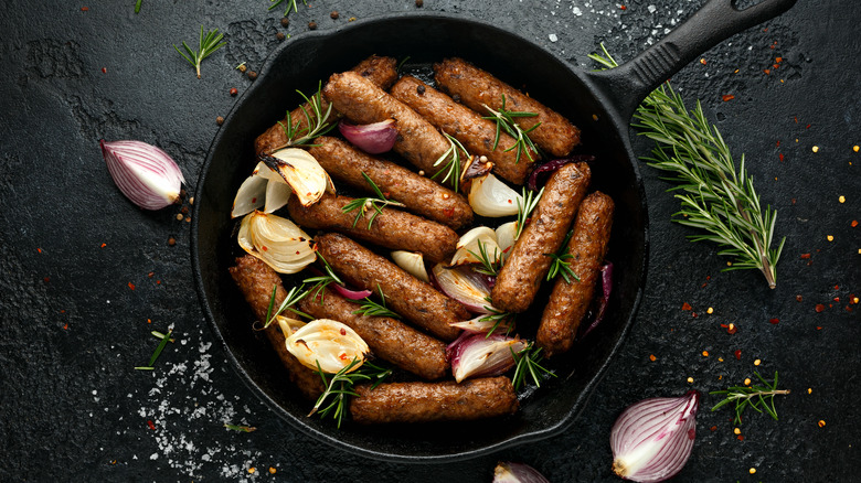 Sausages in cast-iron with onions