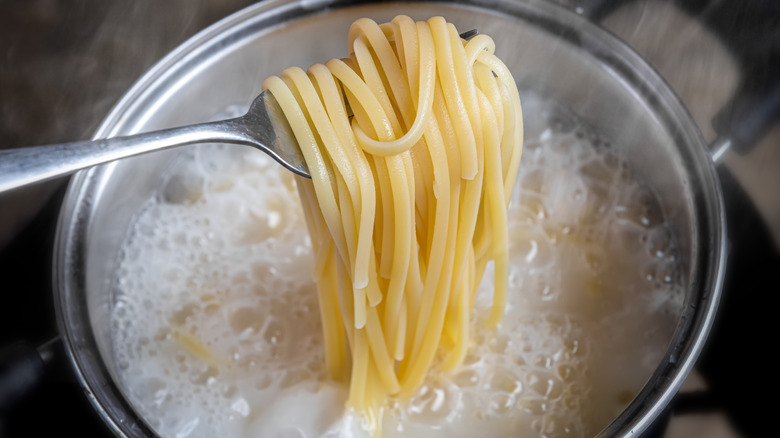 pasta cooking in starchy water