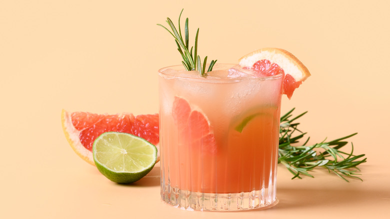 Paloma cocktail with grapefruit wedges