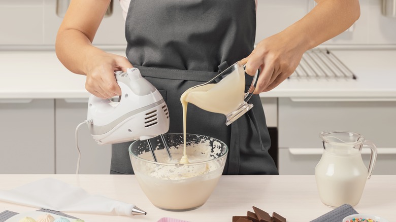 mixing batter with milk