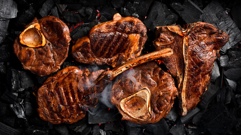 A variety of steak products on a dark background