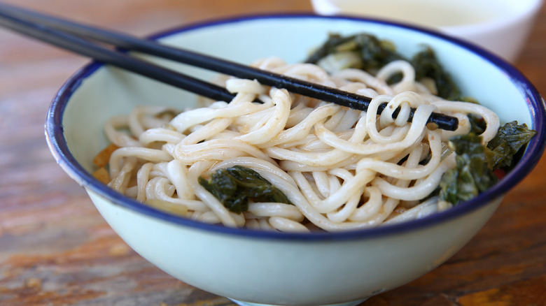 Bowl of noodles with chopsticks