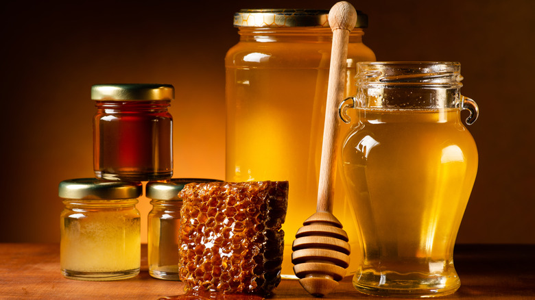 Jars of honey and honeycomb