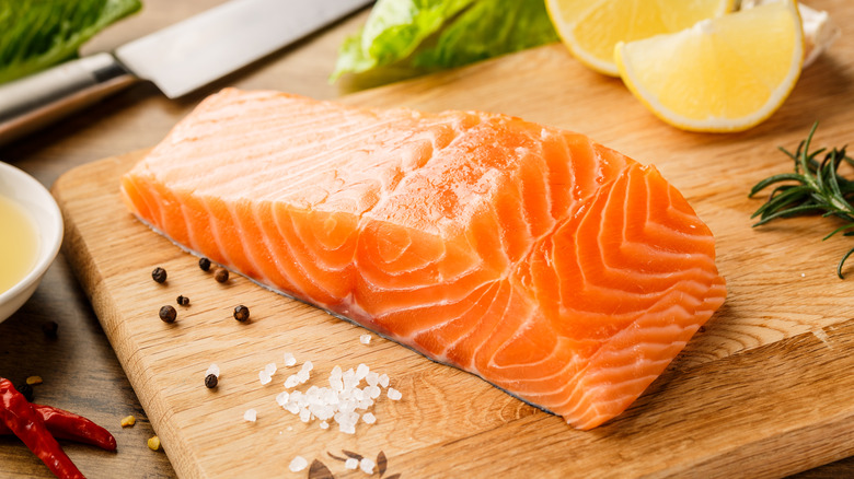 Salmon on wooden cutting board