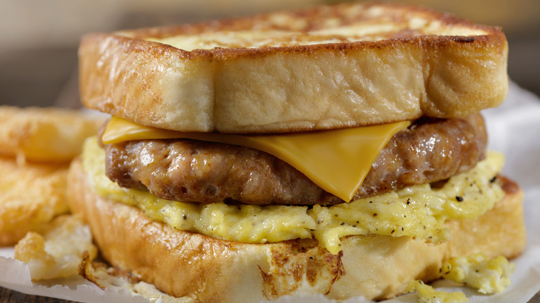 sausage egg and cheese between two slices of bread