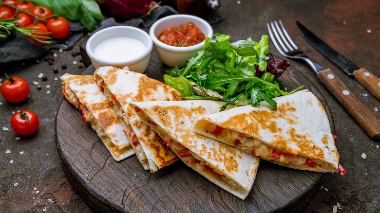 Cut chicken quesadilla on a plate