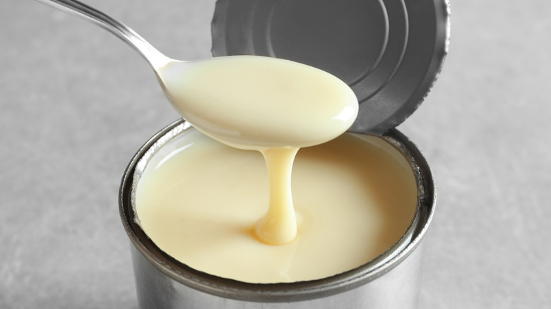 condensed milk spooned from can