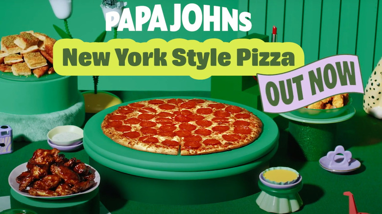 papa johns ny pizza on green background