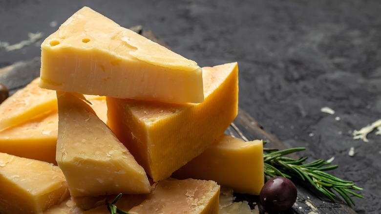 Parmesan cheese on cutting board