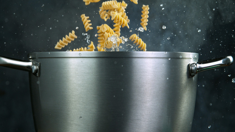 Pasta falling into a pot