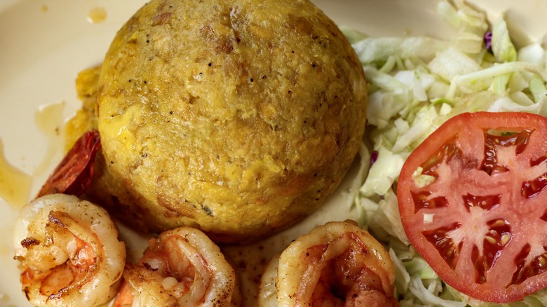 Mofongo with shrimp and salad