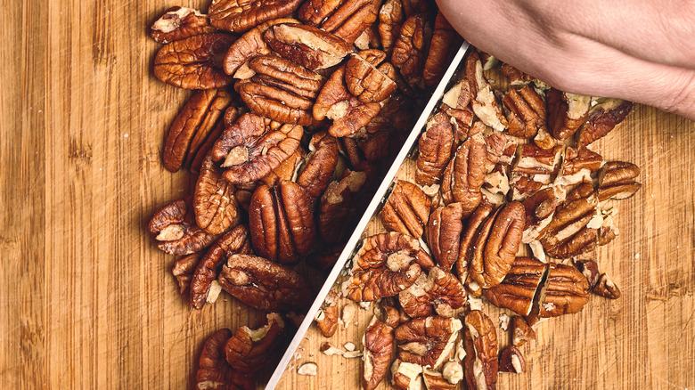 Person chopping pecans