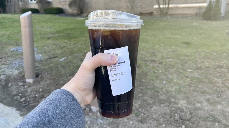 Coffee cup held in a hand