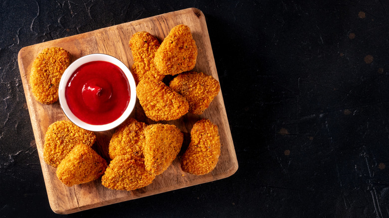 chicken nuggets black background