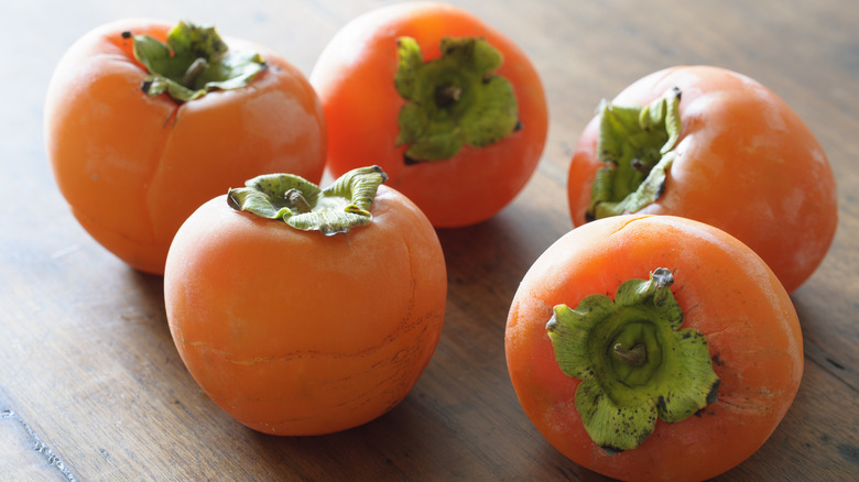 persimmons on table