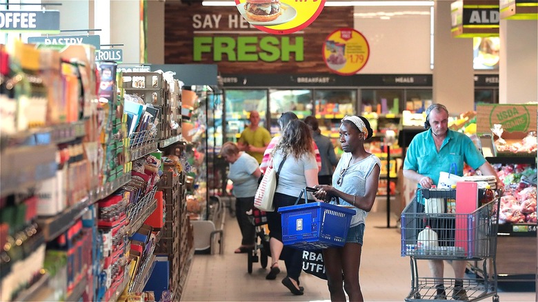 Aldi shoppers with carts and baskets 