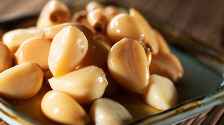 pickled garlic cloves on plate