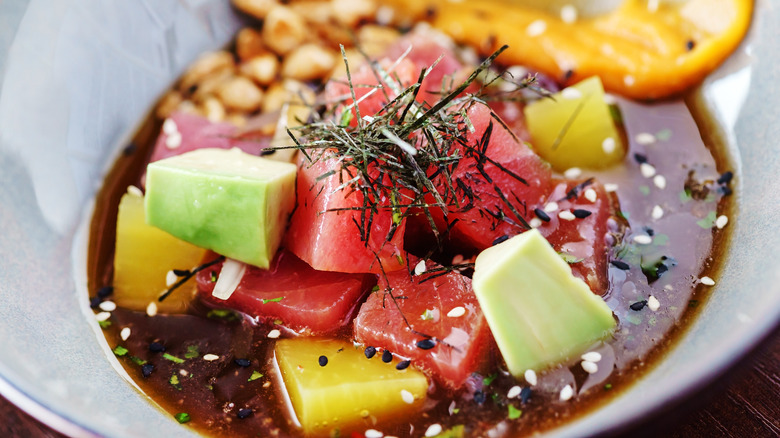 Raw tuna, avacado, and yellow fruit in sauce