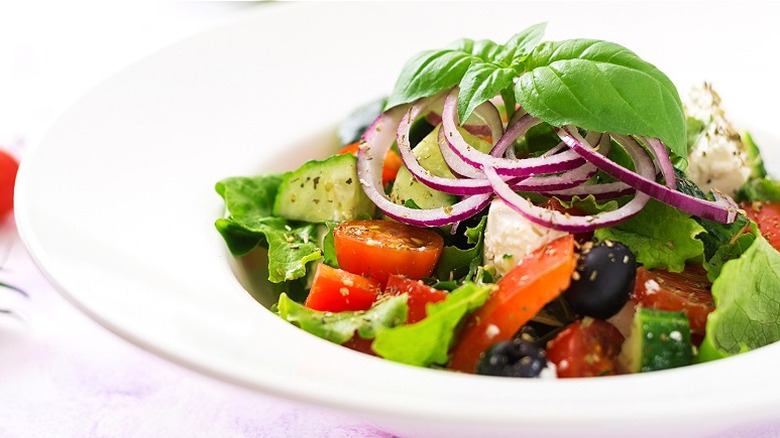 Plate of Italian salad with basil