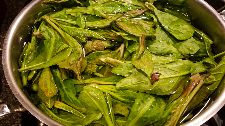 pot of poke leaves in water