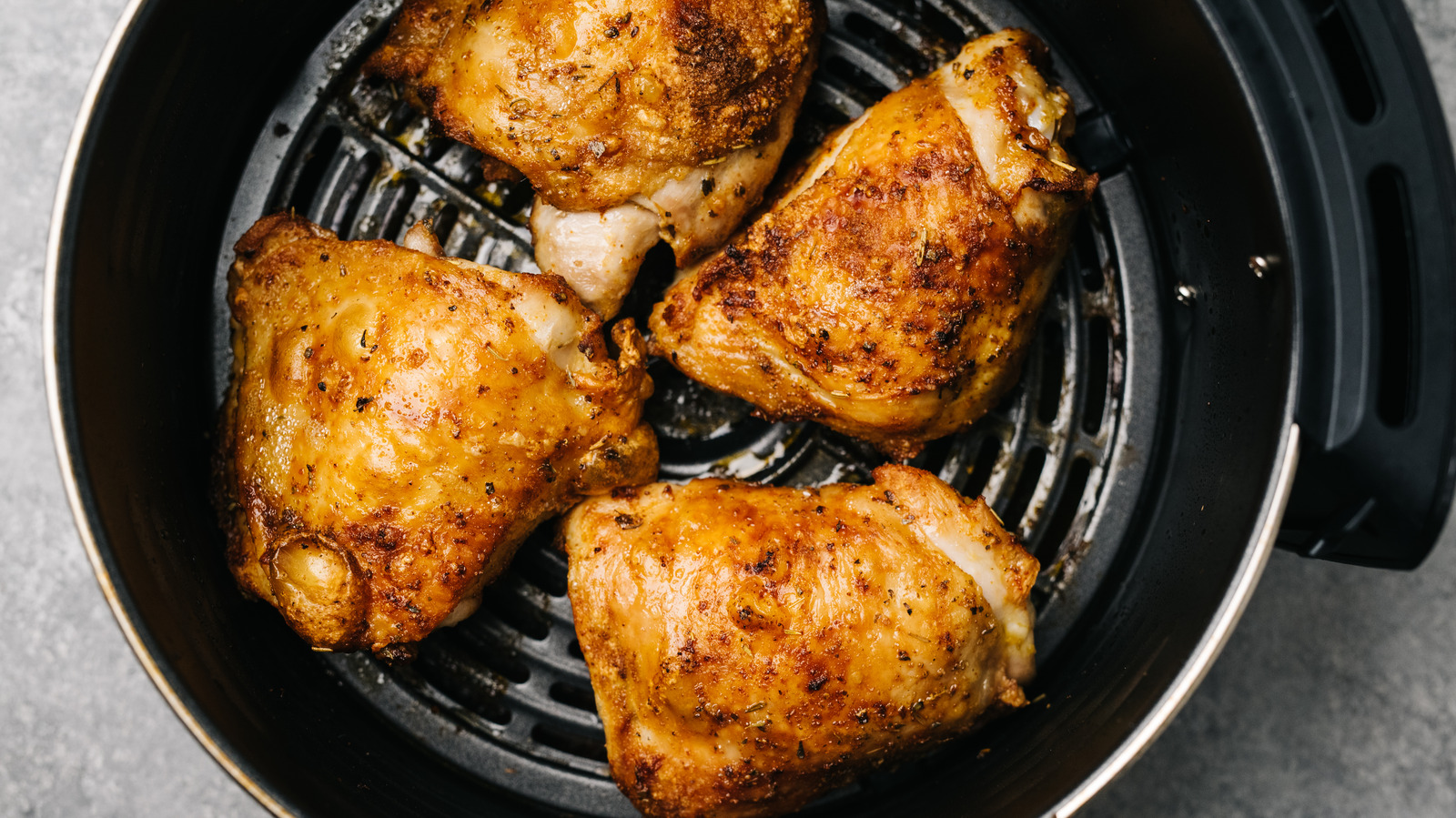 https://www.thedailymeal.com/img/gallery/poke-your-air-fryer-chicken-for-the-crispiest-skin-imaginable/l-intro-1676292545.jpg