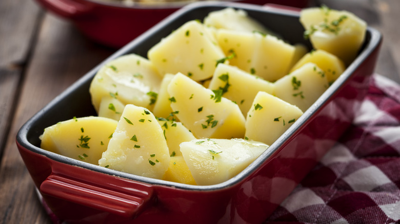 Potatoes in red baking dish