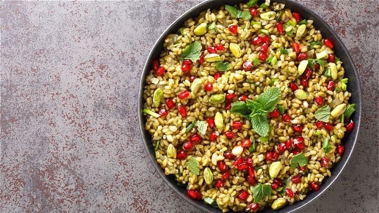 Rice-like dish with pomegranate and mint