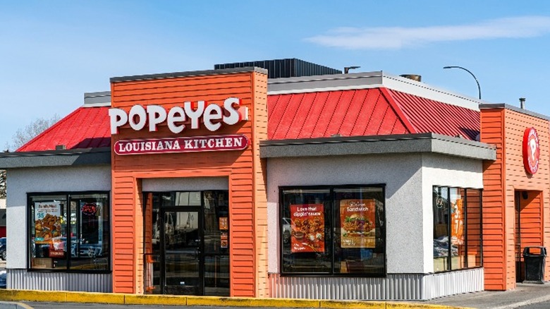 A Popeyes restaurant with blue sky