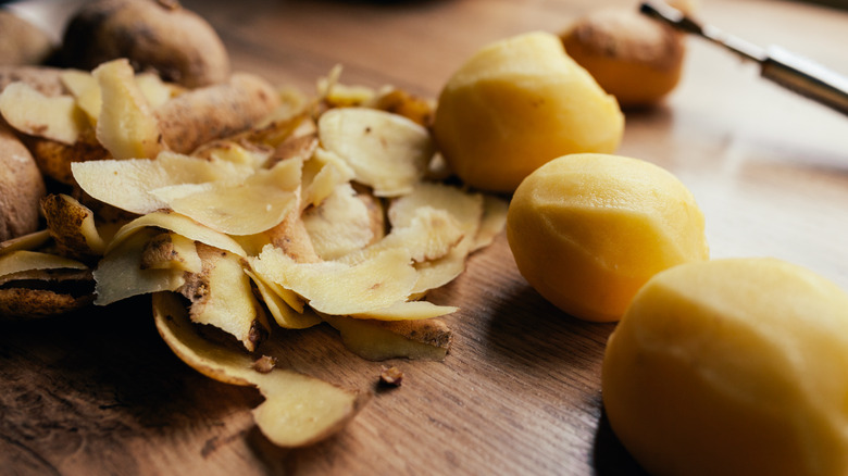 potato peels on a cutting board